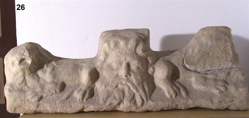 A cornice with two lions and Serapis head from white marble